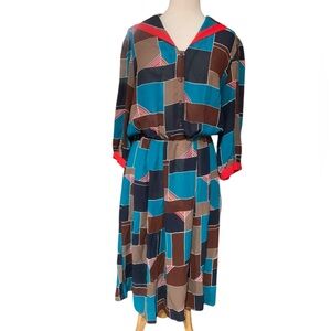 Vintage 70’s volup long sleeved midi dress with multi colored pattern size 16